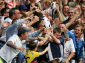 Jermain Defoe is swamped by jubilant East Lower fans, after his stunning goal