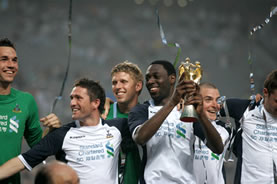 Ledley proudly holds aloft the Peace Cup. Let's hope he gets to go through a similar winning process before the end of the forthcoming season!
