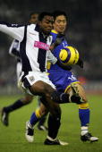 Spurs left-back Young-Pyo lee in action against Nathan Ellington