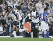 Mido and Defoe celebrate, leaving edx-Spur Simon Davies to mope about what might have been