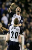 Robbie Keane celebrates with Michael Dawson