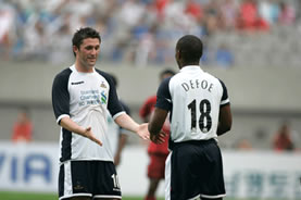 Winner of the Golden Ball award, Robbie Keane, greets his replacement Jermain Defoe