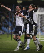 Robbie Keane celebrates his clinching goal in front of the ecstatic away fans