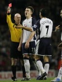Michael Carrick can't believe it, but Paul Stalteri has been shown red for a professional foul