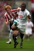 Spurs substitute Darren Bent battles for the ball with Sunderland's Paul McShane, who was a candidate for man of the match