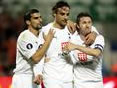 Robbie Keane tries to make Dimitar Berbatov smile about Spurs' second goal!