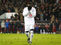 Pascal Chimbonda holds his head in his hands after his miss