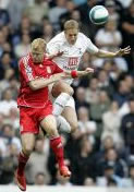 Michael Dawson wins this aerial challenge against Riise