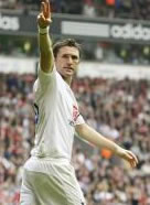 Robbie Keane salutes his fans after his second goal