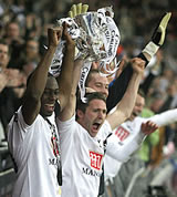 Ledley King and Robbie Keane lift up the Carling Cup after our magnificent win over Chelsea on February 24th, 2008