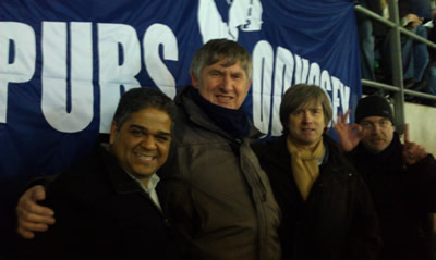 From left to right, Cassim Patel, Paul Smith, Stuart Gibson and Andy Park (indicating the score) at the San Siro in front of the Spurs Odyssey flag