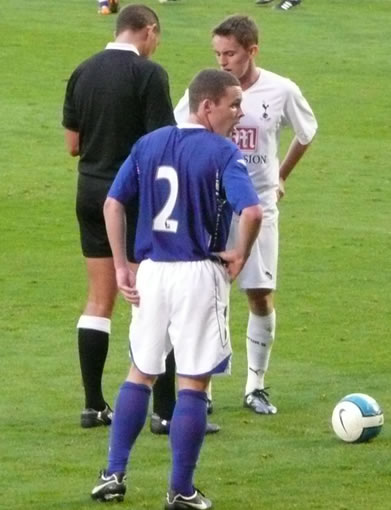 Midfielder Kieran McKenna gets a booking for a late challenge.