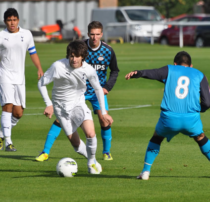 Cristian Ceballos dances around PSV's Tufan Ozbozkurt, before scoring Spurs' opening goal